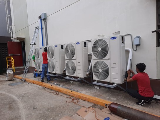 Outdoor air-conditioning units installed along a facility wall